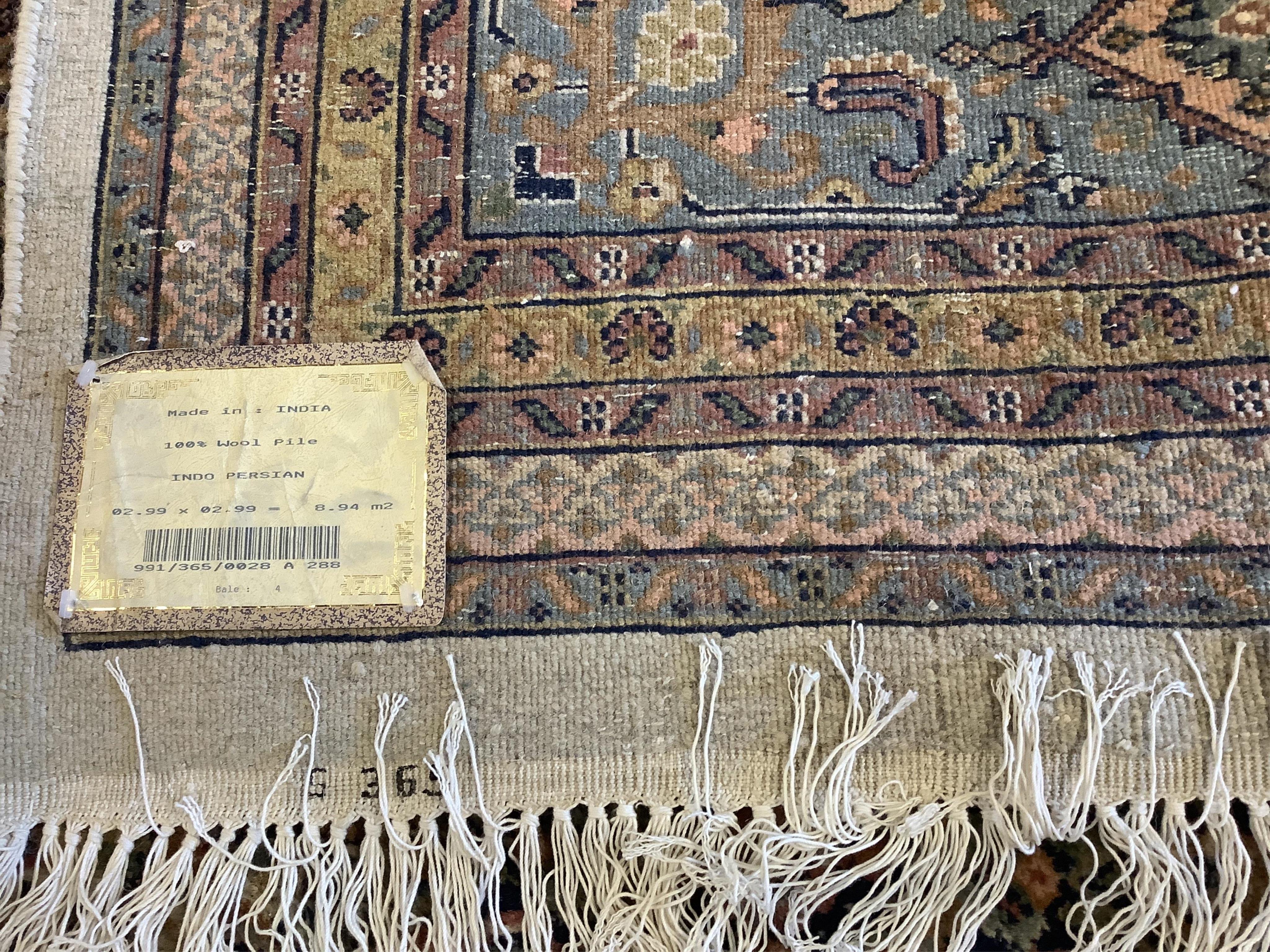 A North West Persian ivory ground carpet, 294cm x 299cm, matching previous Lot. Condition - fair